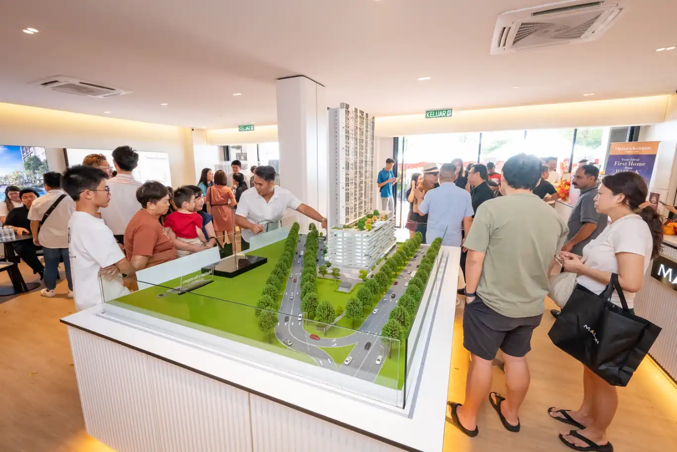Crowd viewing the scale model at Mutiara Kempas Sales Gallery